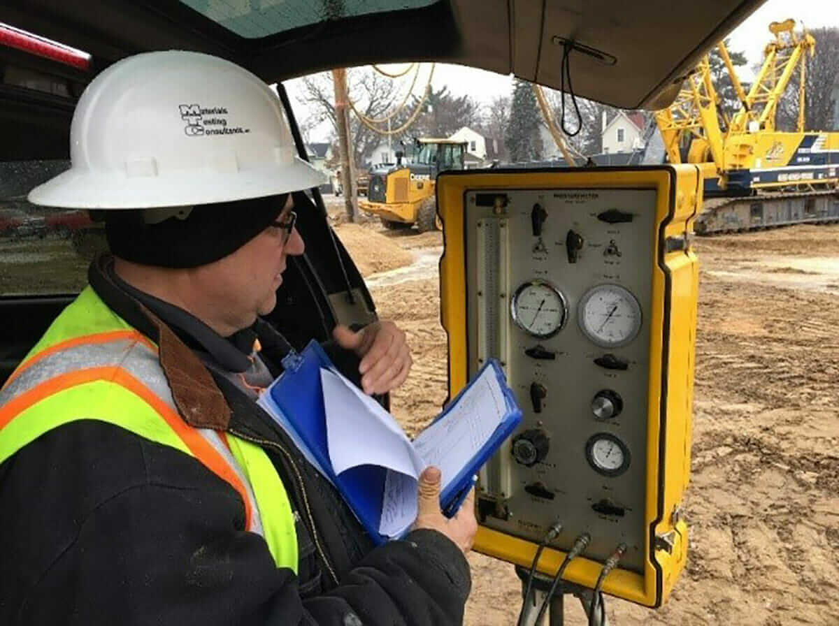 MTC CMT field staff using geotechnical equipment for an environmental 