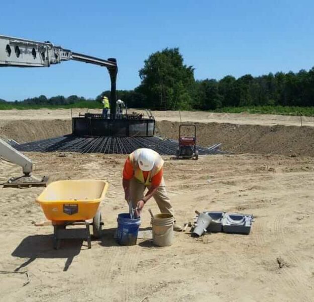 MTC technician obtaining samples for field testing of concrete on a wind farm project
