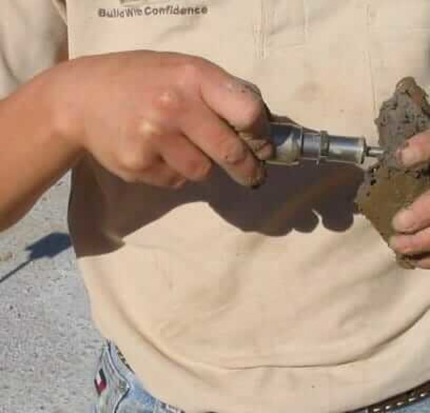 MTC technician analyzing soil sample