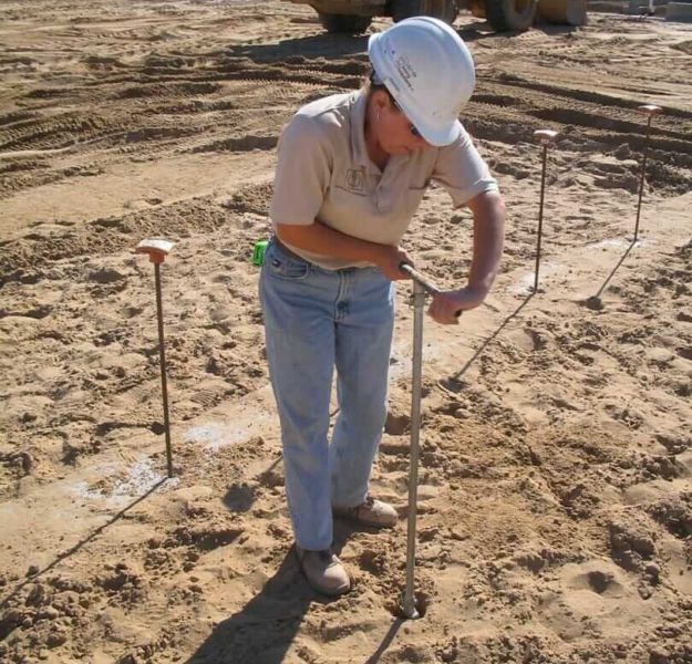 MTC technician obtaining hand auger soil samples