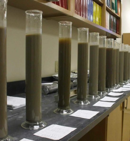 Hydrometer testing in process in soils testing lab