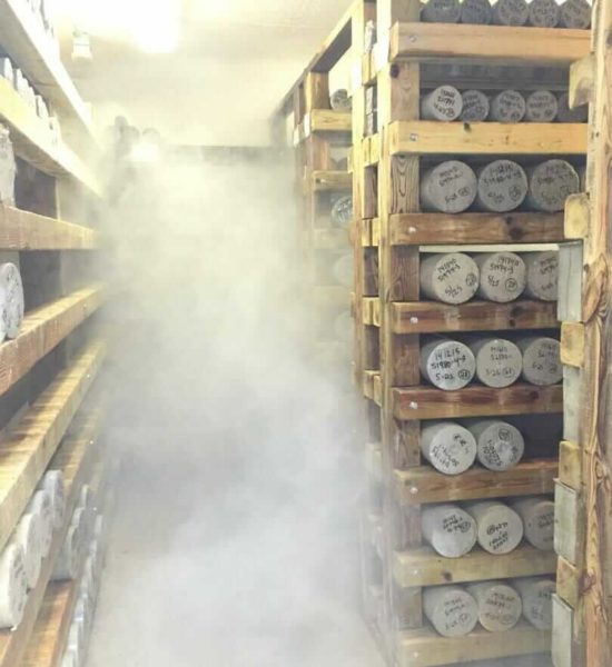 Concrete testing cure room, concrete cylinders on shelves keep cylinders moist prior to testing